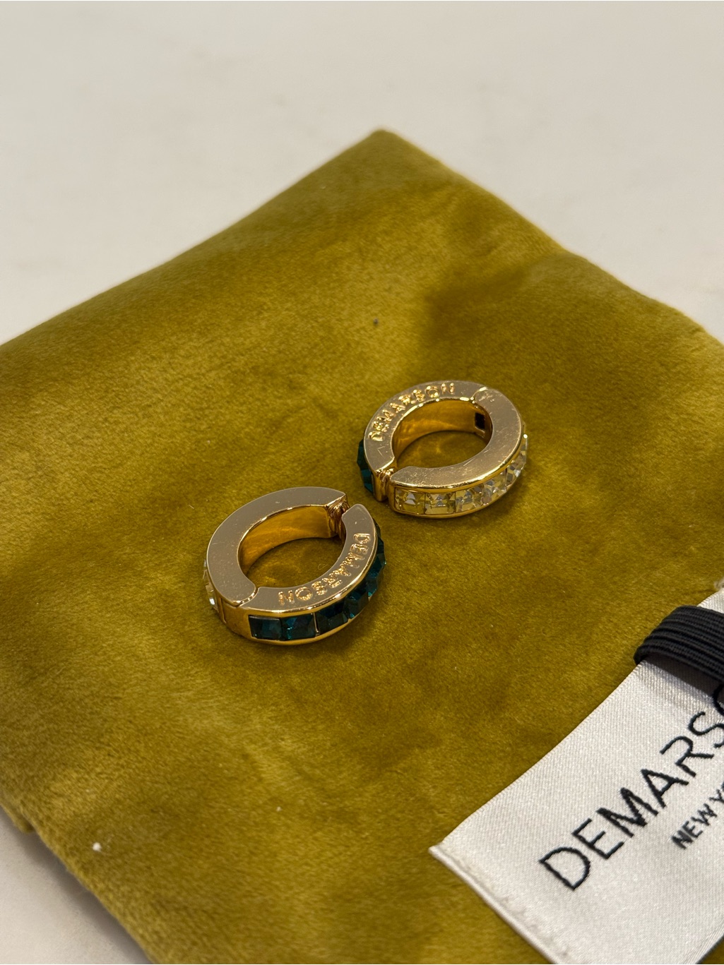 Demarson Hoop Clip On Earrings With Green And Clear Stones